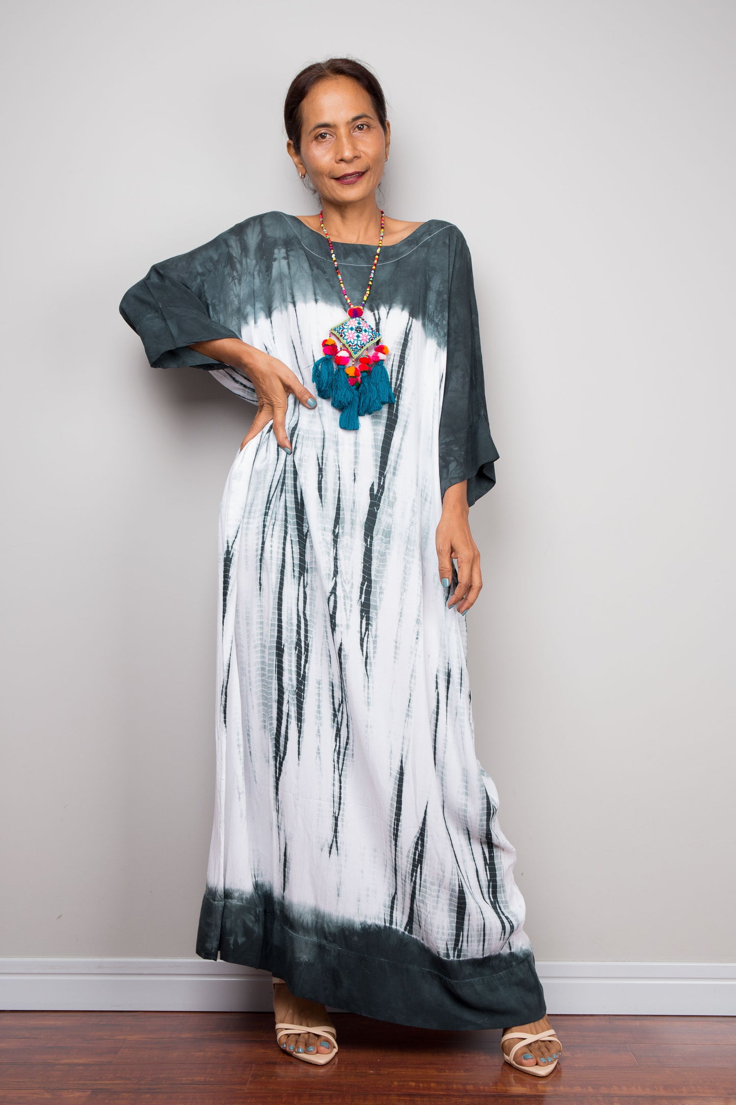 Full-length view of the relaxed fit rayon cotton Shibori tie dye summer maxi dress by Nuichan, displaying its fluid drape and classic boat neckline.