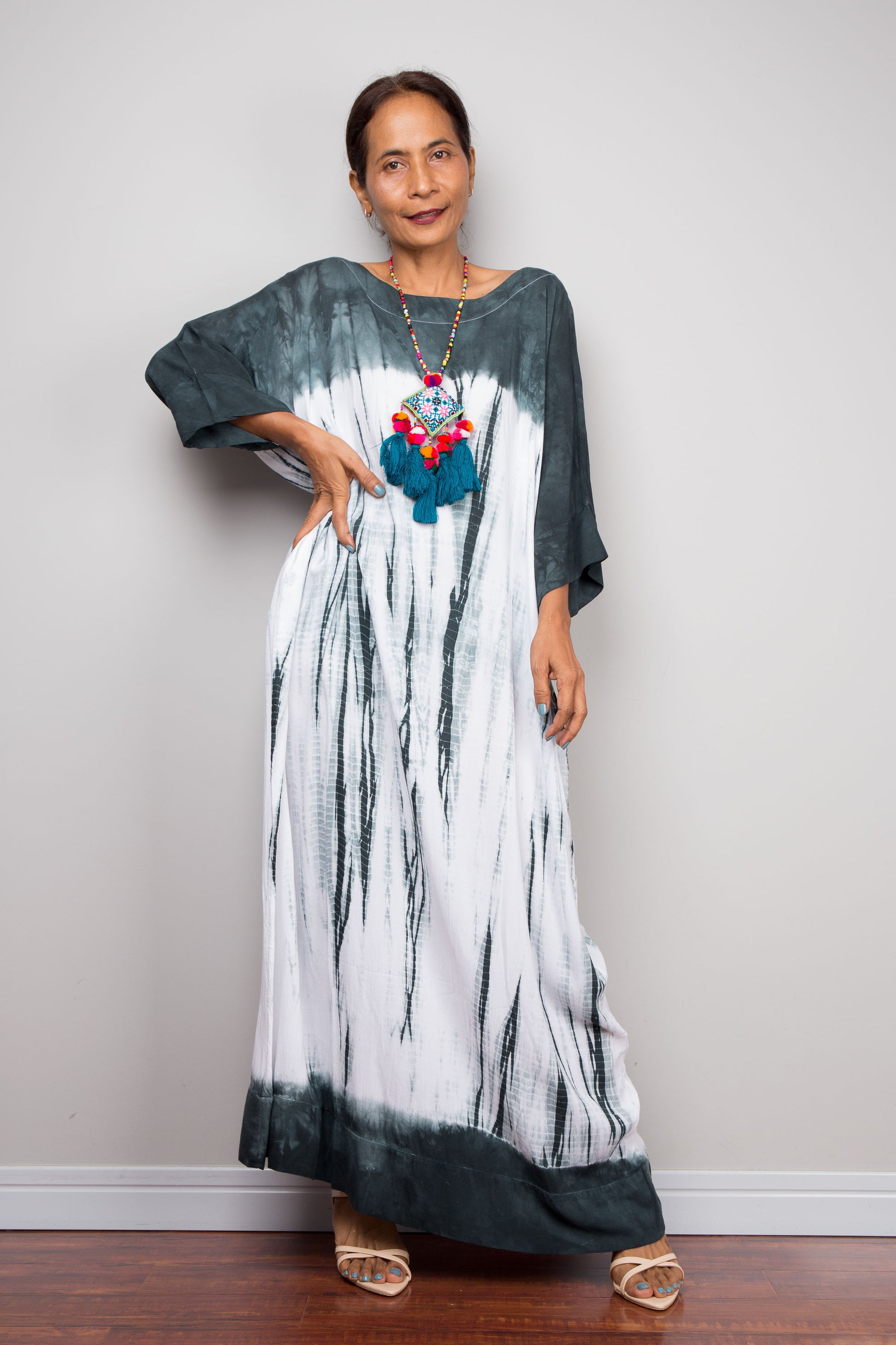 Full-length view of the relaxed fit rayon cotton Shibori tie dye summer maxi dress by Nuichan, displaying its fluid drape and classic boat neckline.