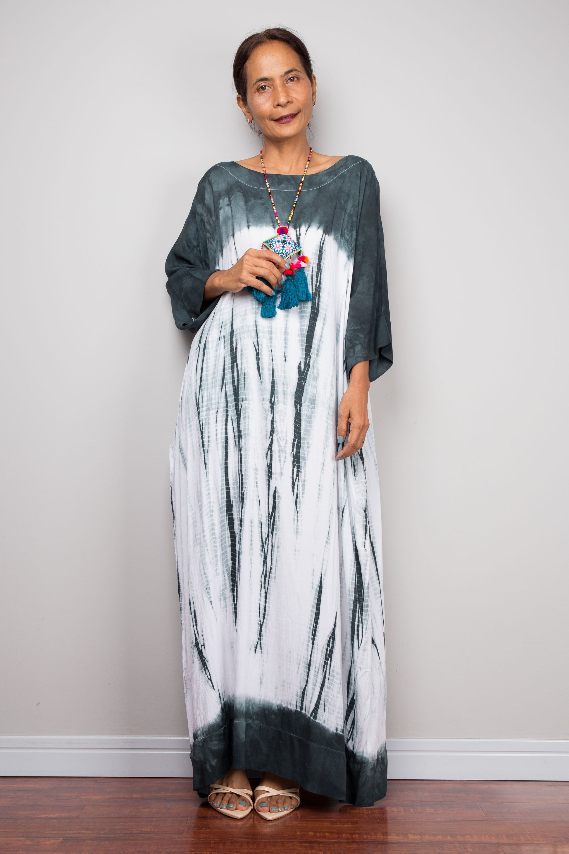 Front full-length view of the rayon cotton Shibori tie dye dress by Nuichan, displaying its fluid drape and classic boat neckline.