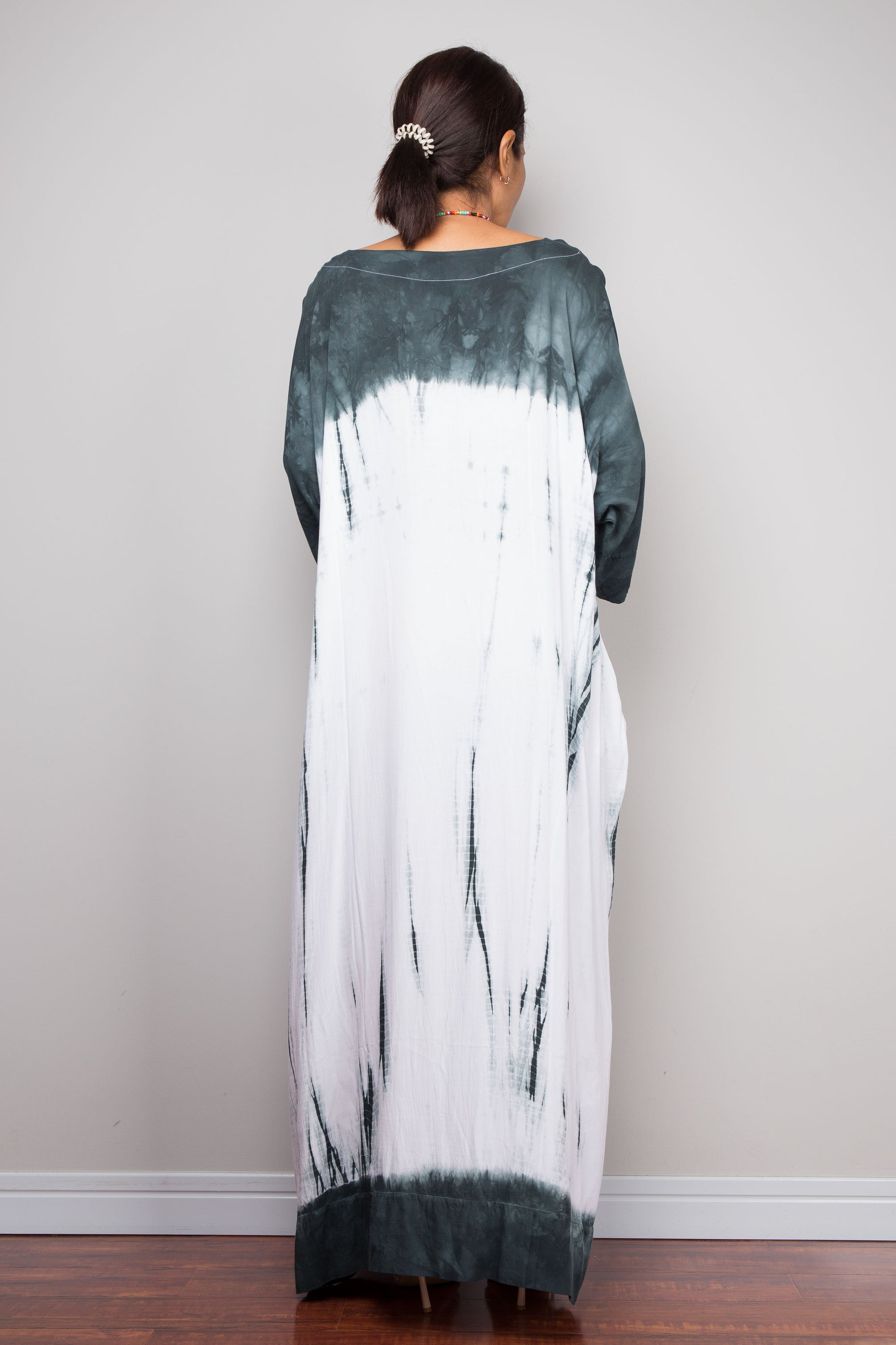 Back view of the relaxed fit rayon cotton Shibori tie dye maxi dress by Nuichan, displaying its fluid drape and classic boat neckline.