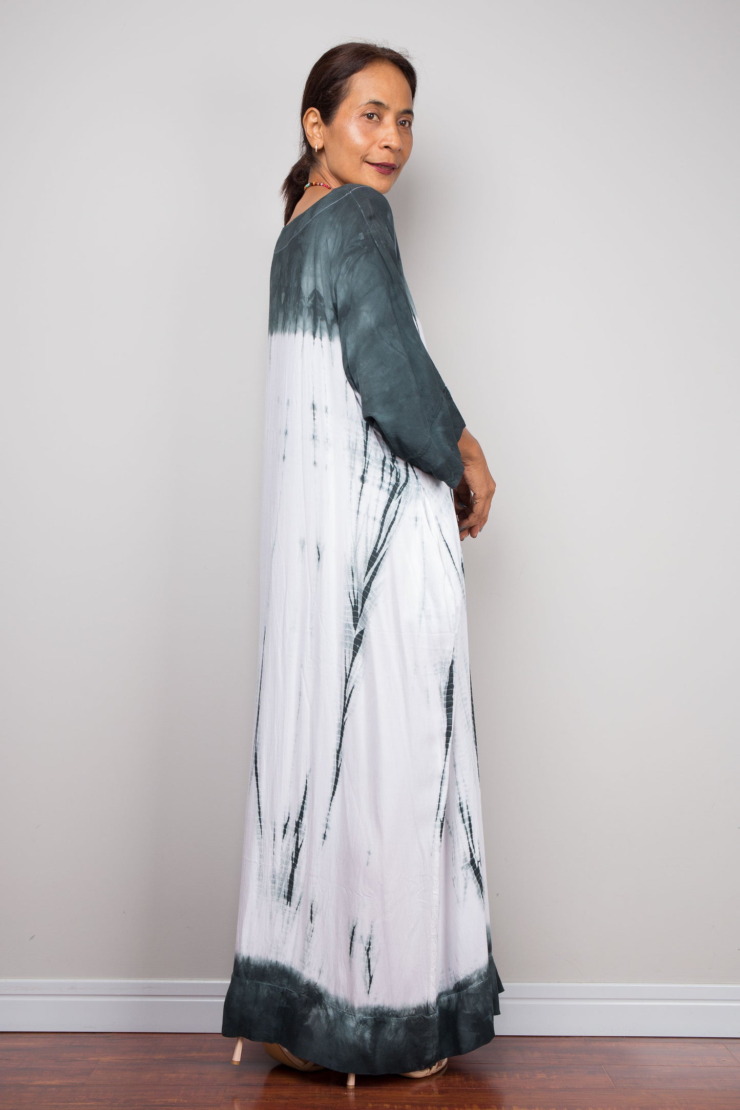 Back Side full-length view of the relaxed fit rayon cotton Shibori tie dye summer dress by Nuichan, displaying its fluid drape and classic boat neckline.