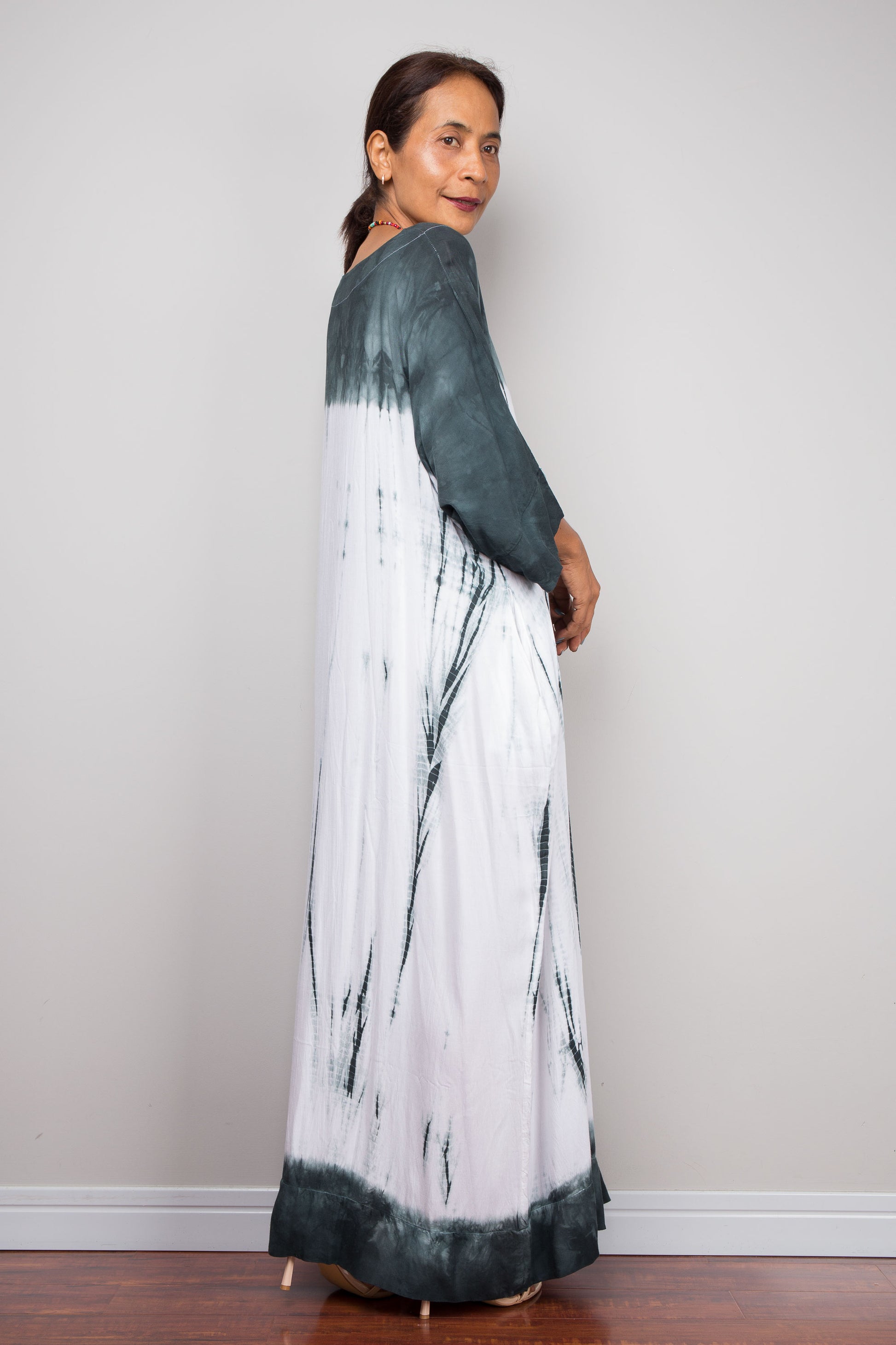 Back Side full-length view of the relaxed fit rayon cotton Shibori tie dye summer dress by Nuichan, displaying its fluid drape and classic boat neckline.