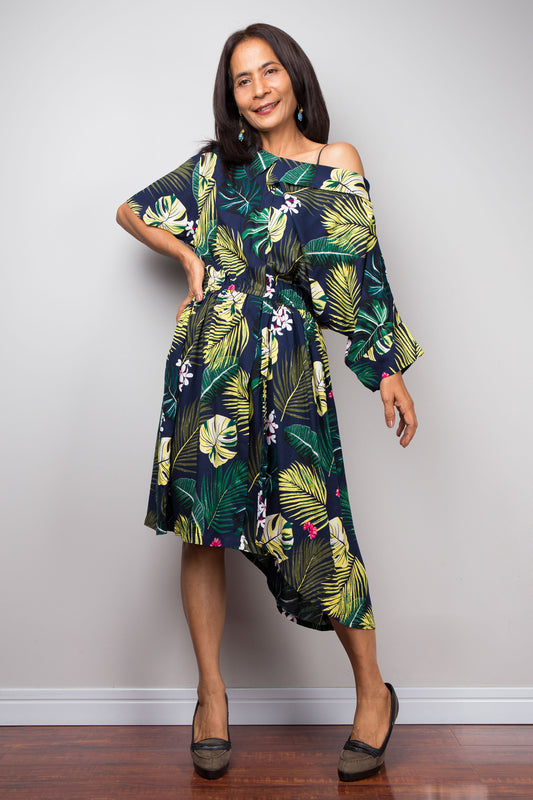 Tropical palm leaf midi dress in navy with green and yellow floral pattern, 100% cotton, ideal for women’s boho summer style.  

