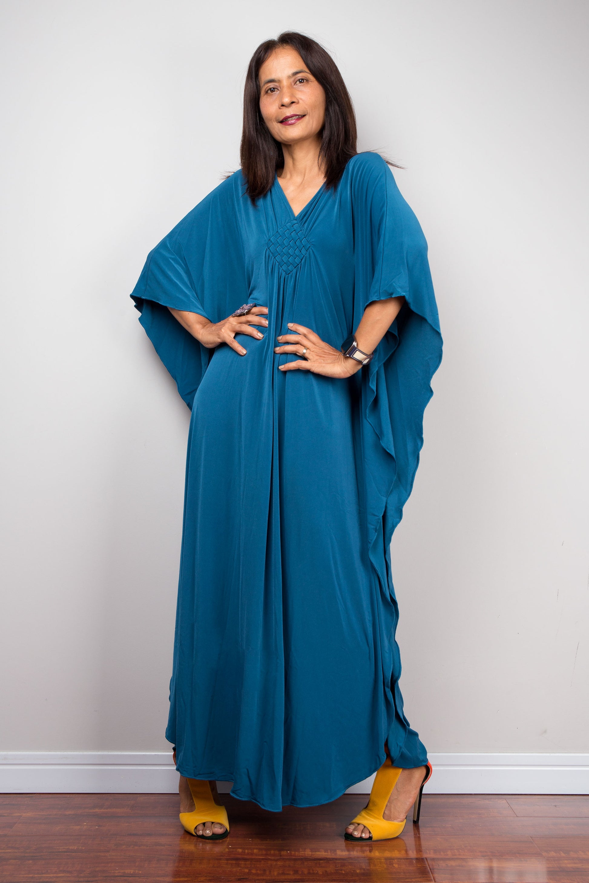Teal Beach Cover-Up Kaftan for Small Frames
Vibrant teal kaftan dress, tailored for petite women, doubles as a chic beach cover-up. This short summer caftan, made from lightweight polyester-spandex, ensures comfort and style for small body types.  