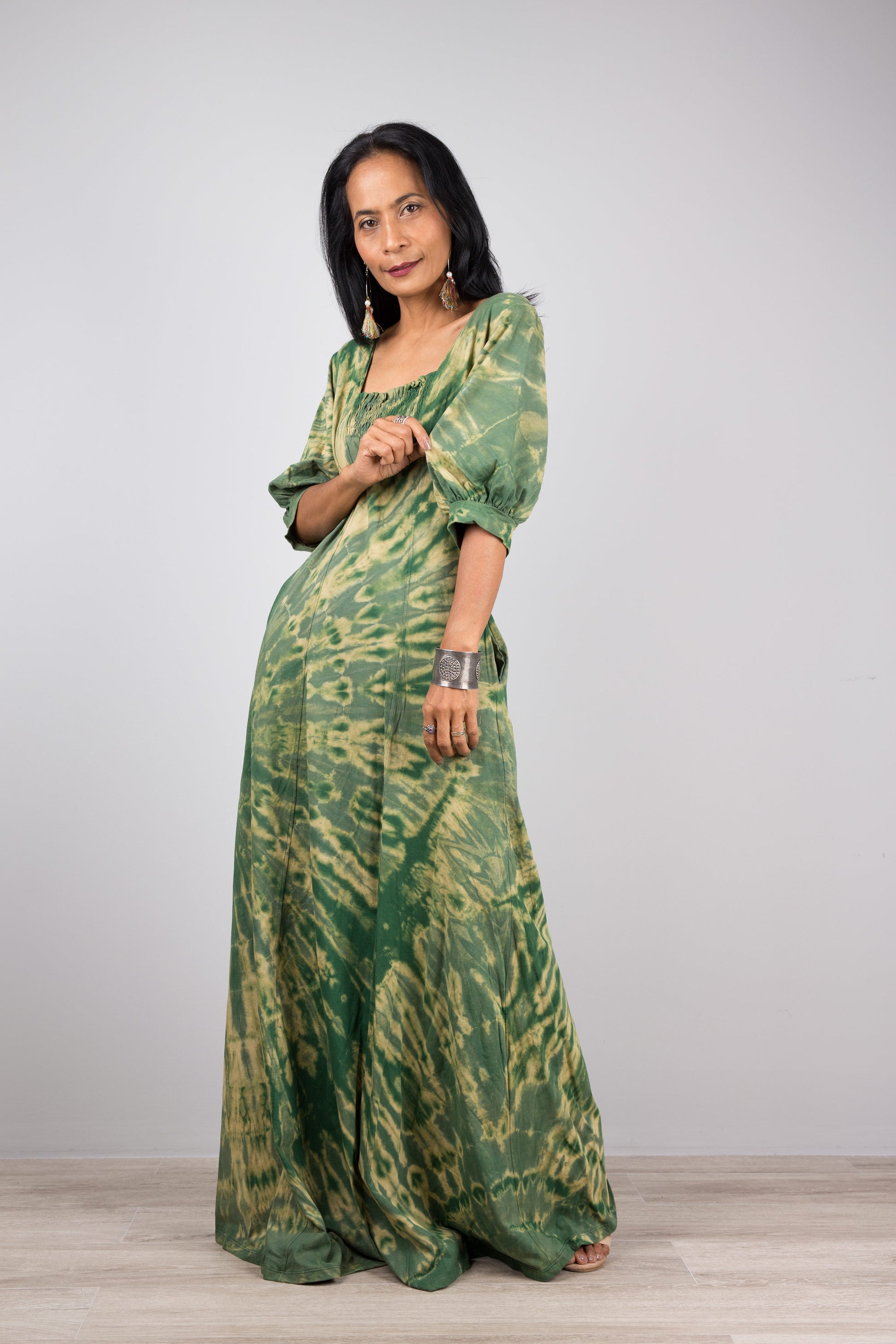 Green tie dye maxi dress with 3/4 sleeves and pockets.  U shaped neckline