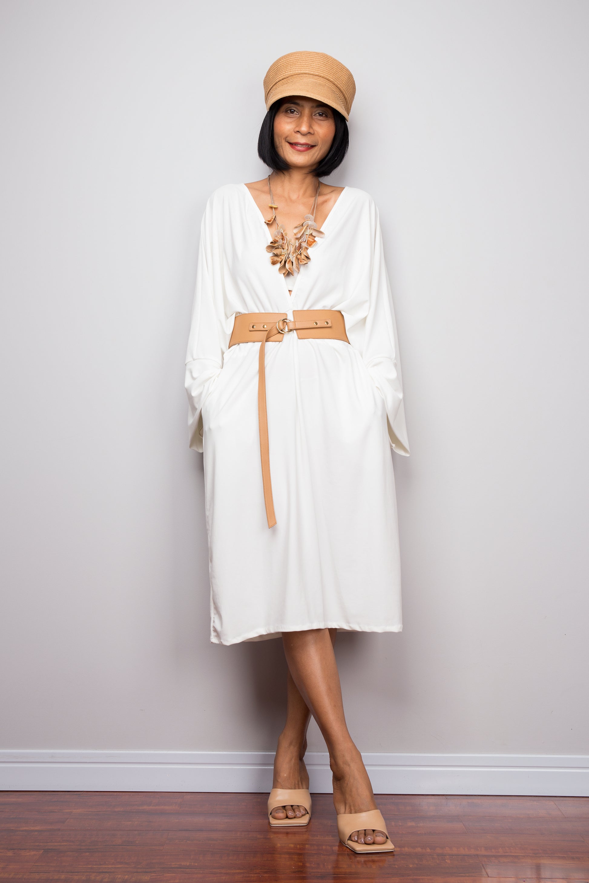 Buy short white dress online.  Off shoulder white dress by Nuichan  Long sleeve white dress with pockets