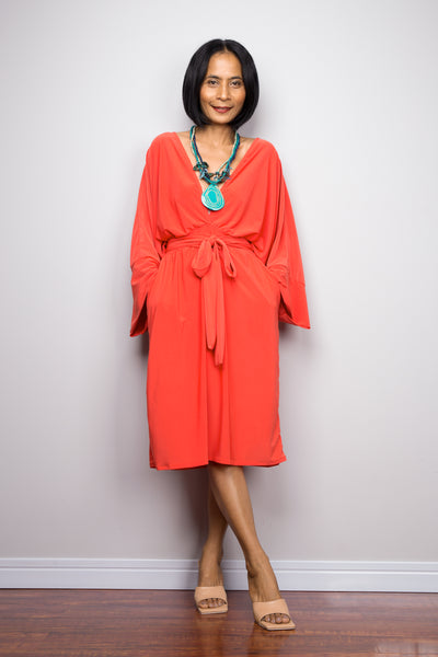 Buy elegant short orange dress online.  Dress with pockets and long sleeves by Nuichan