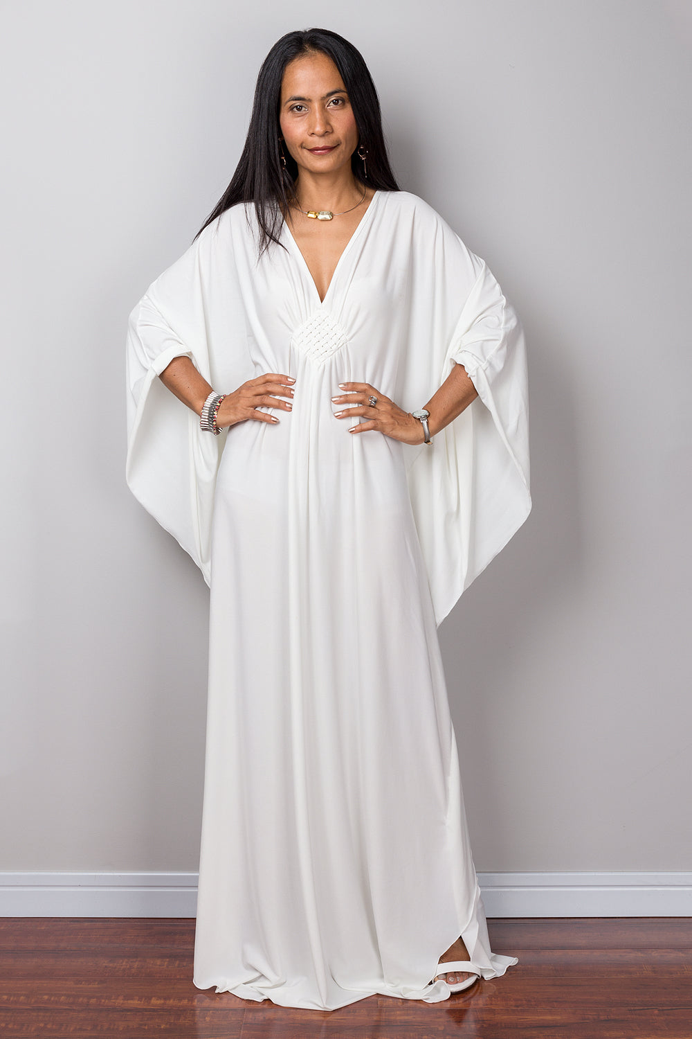 Buy Off white kaftan online.  Shop for white maxi dress by Nuichan.  Caftan style white dress with plunging neckline.