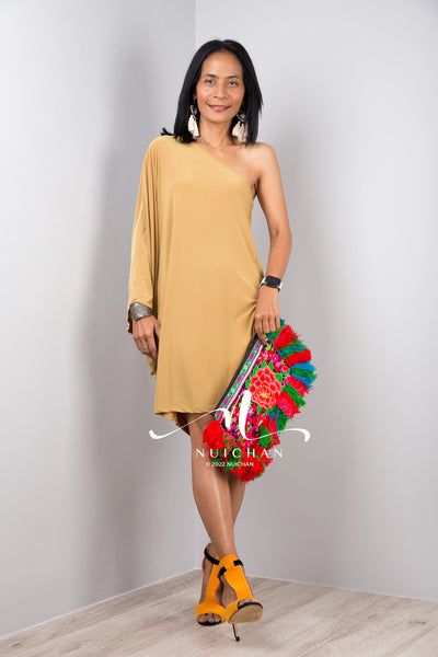 A sexy mustard yellow off shoulder dress for women. Short one shoulder knee length evening cocktail statement dress