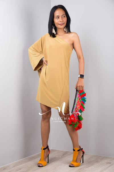 A sexy mustard yellow off shoulder dress for women. Short one shoulder knee length evening cocktail statement dress