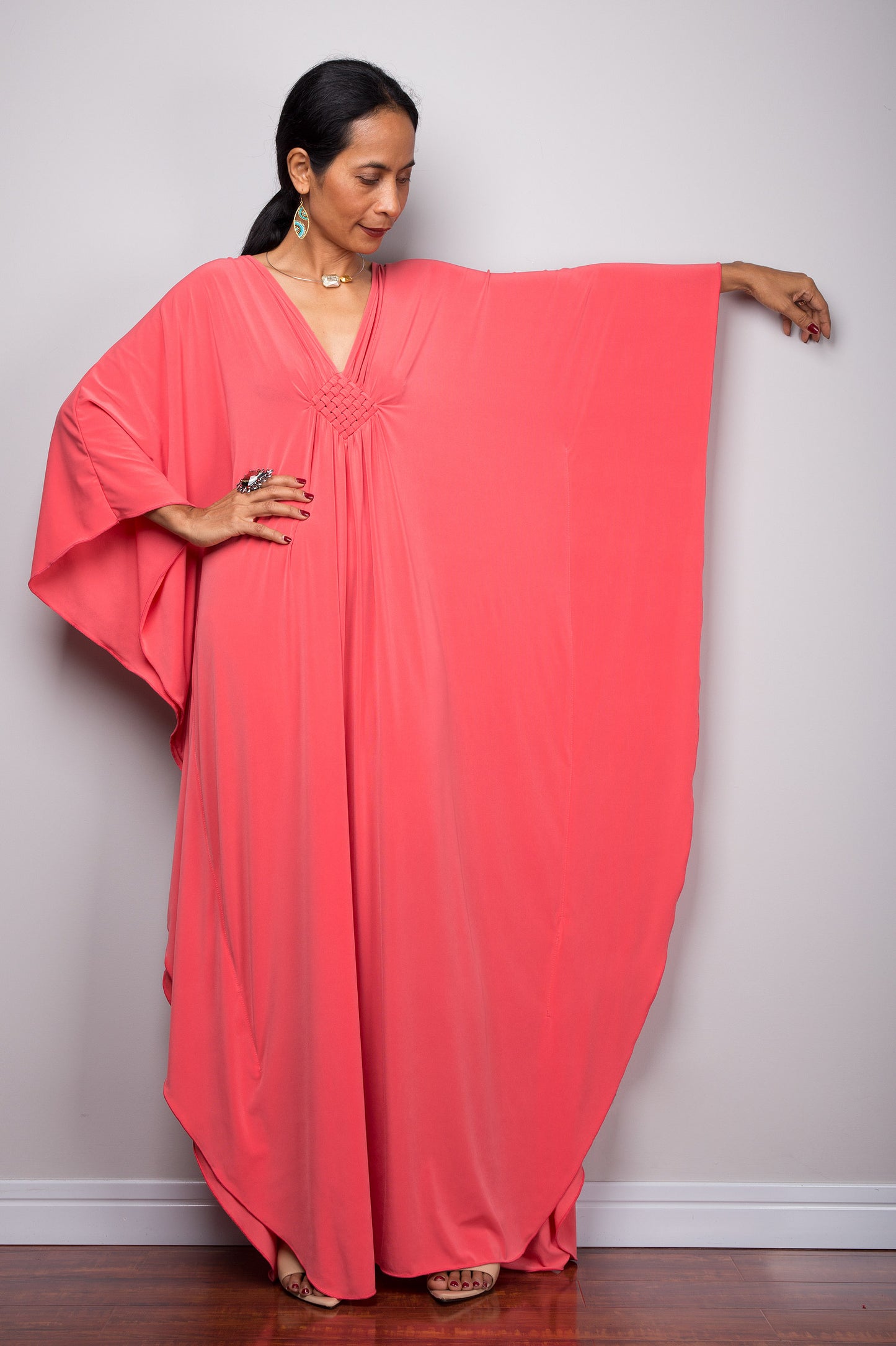 Batwing sleeve kaftan dress by Nuichan - Model opens up the sleeve to show full width