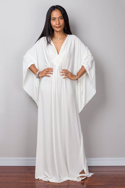Buy Off white kaftan online.  Shop for white maxi dress by Nuichan.  White frock dress with plunging neckline.