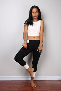 Black legging pants with white cuffs on the bottom, black yoga pants by Nuichan