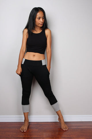 Black legging pants with grey cuffs on the bottom, black yoga pants by Nuichan