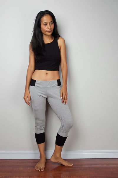 Grey legging pants with black cuffs on the bottom, grey yoga pants by Nuichan