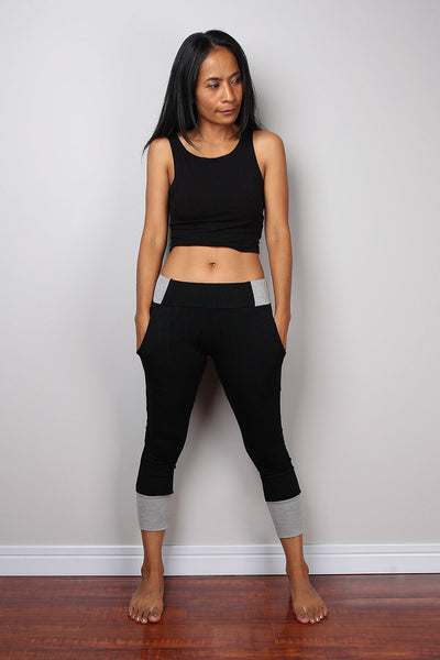 Black legging pants with grey cuffs on the bottom, black yoga pants by Nuichan
