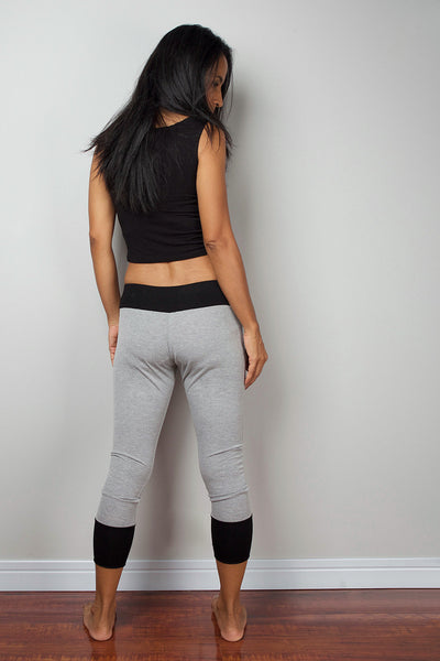 Grey legging pants with black cuffs on the bottom, grey yoga pants by Nuichan