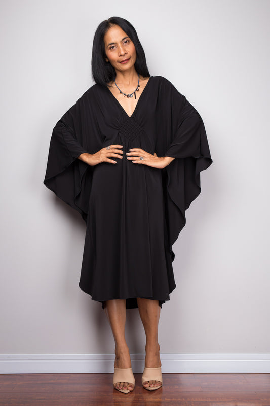Buy Short black dress online.  Black kaftan dress  by Nuichan. Affordable black midi dress with plunging neckline