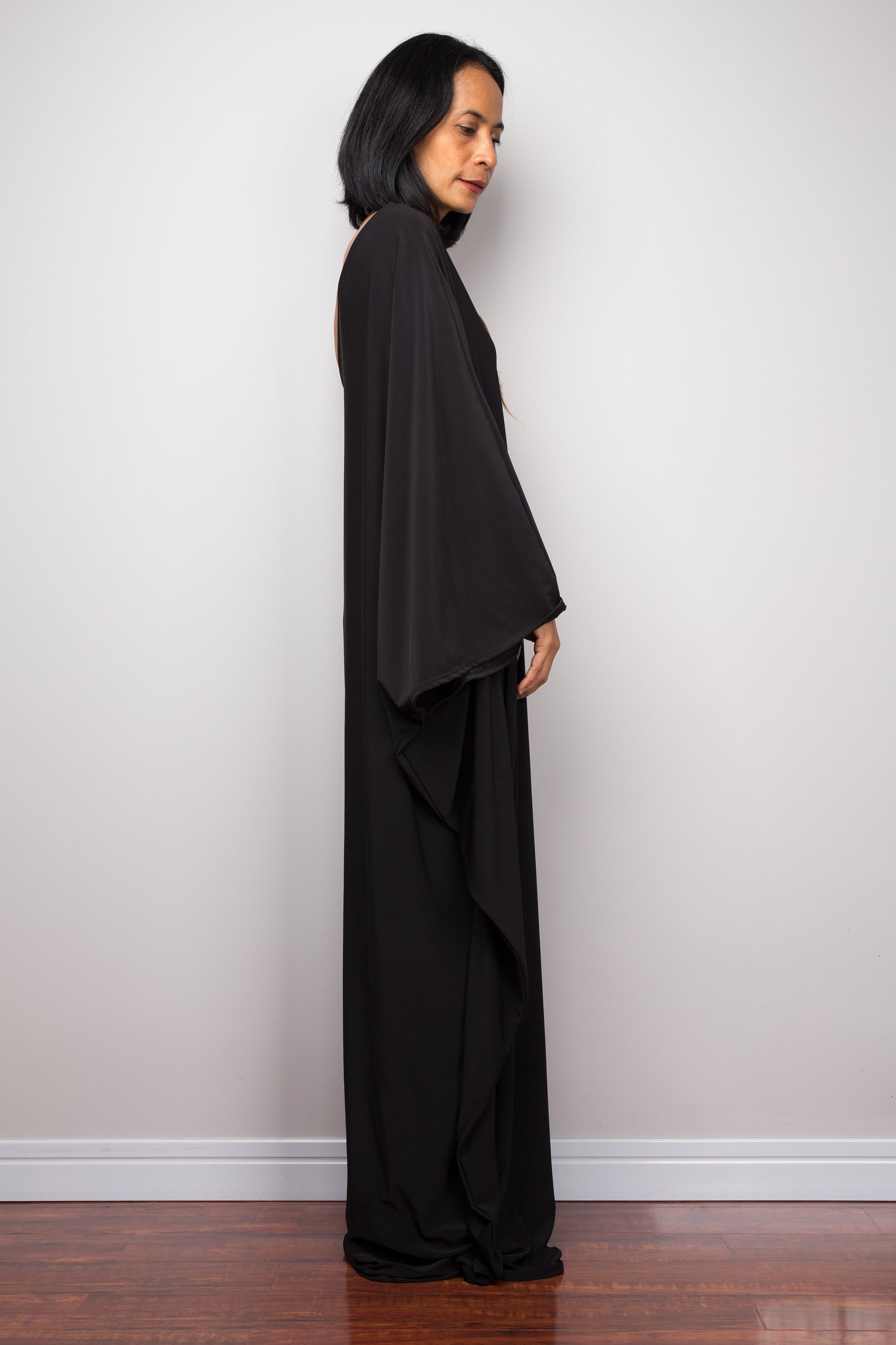 Black one shoulder dress. Side view