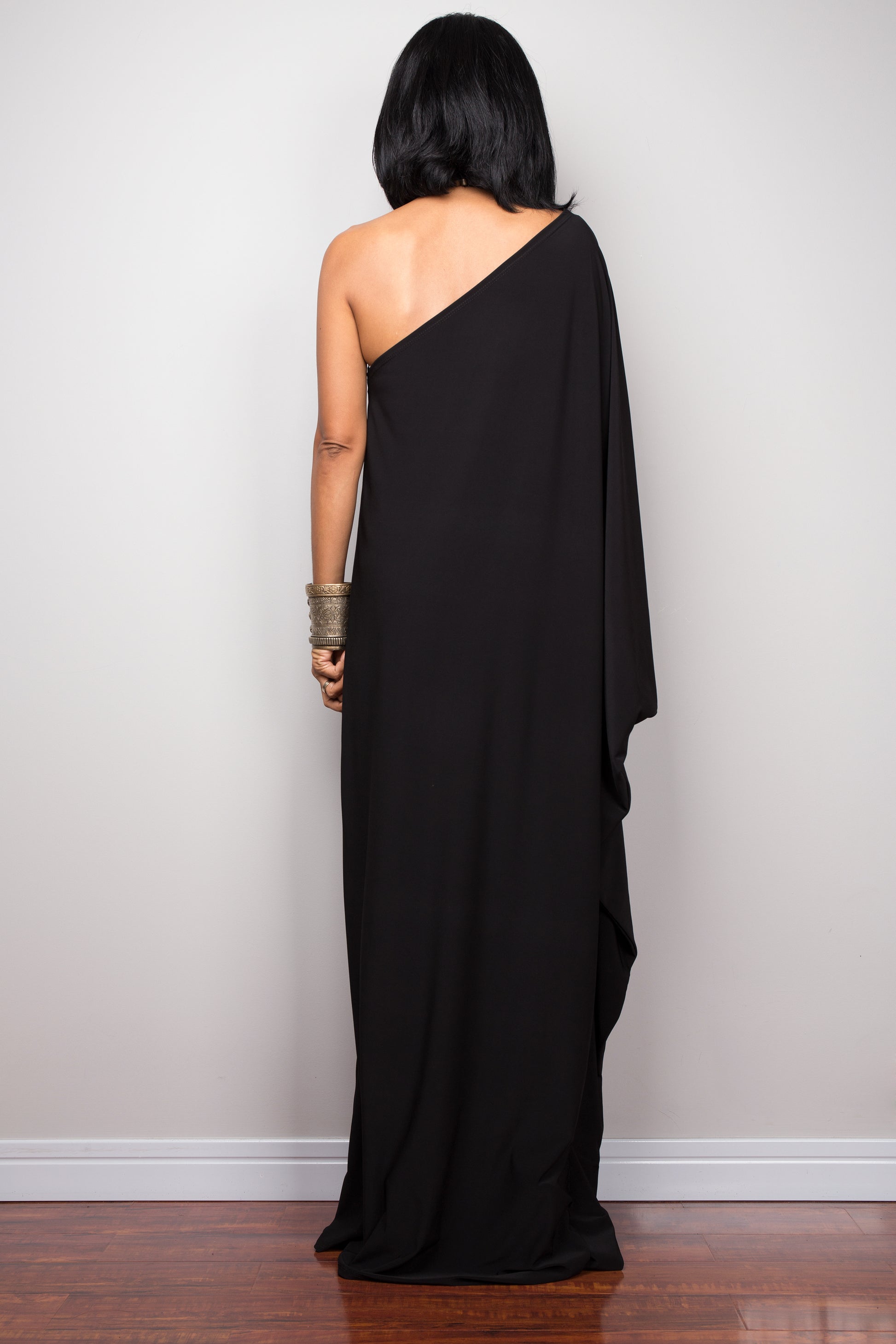 Black one shoulder dress by Nuichan. Back view