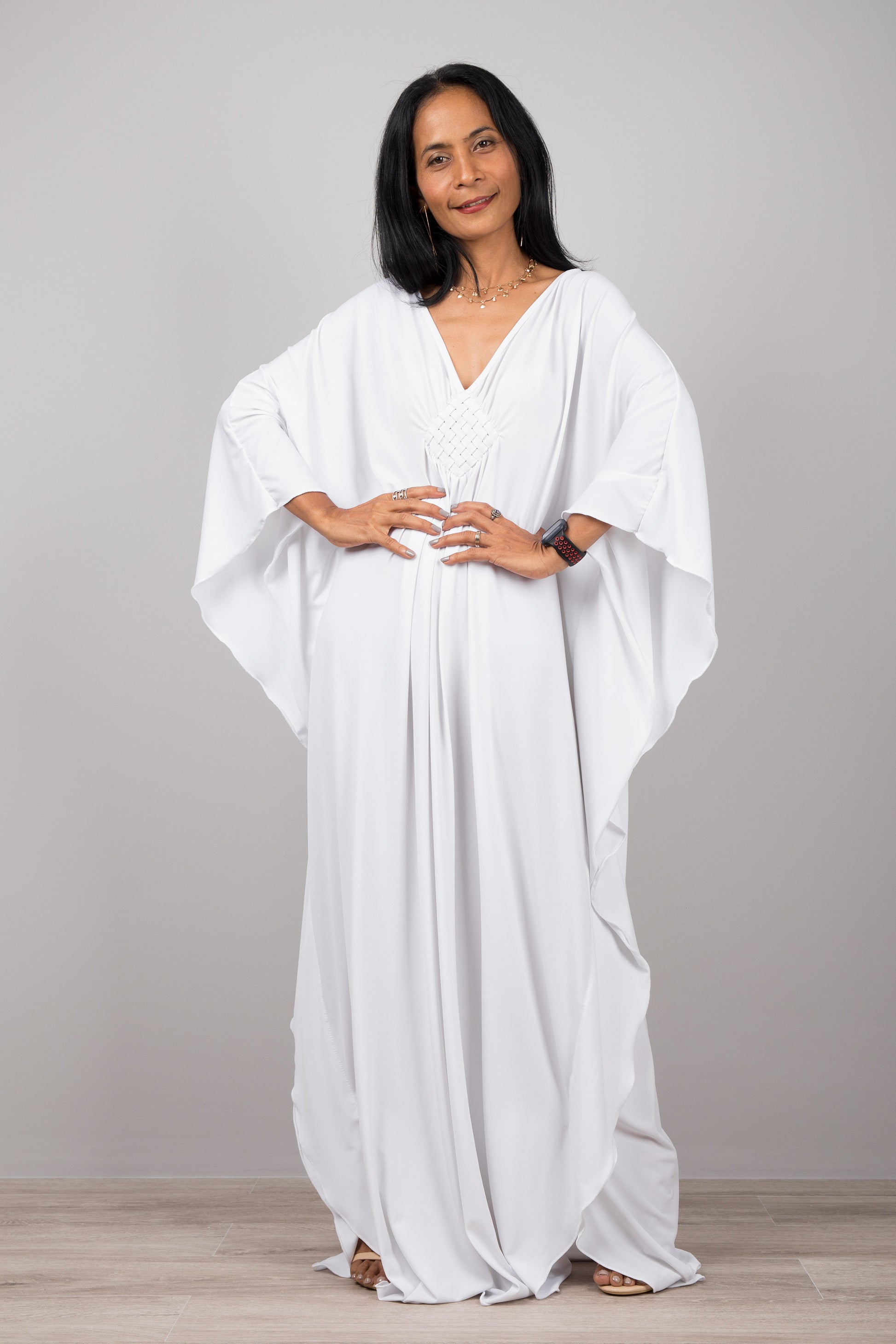 White kaftan dress with plunging neckline.  Buy your timeless greek goddess dress online from Nuichan.  Express worldwide delivery via DHL.