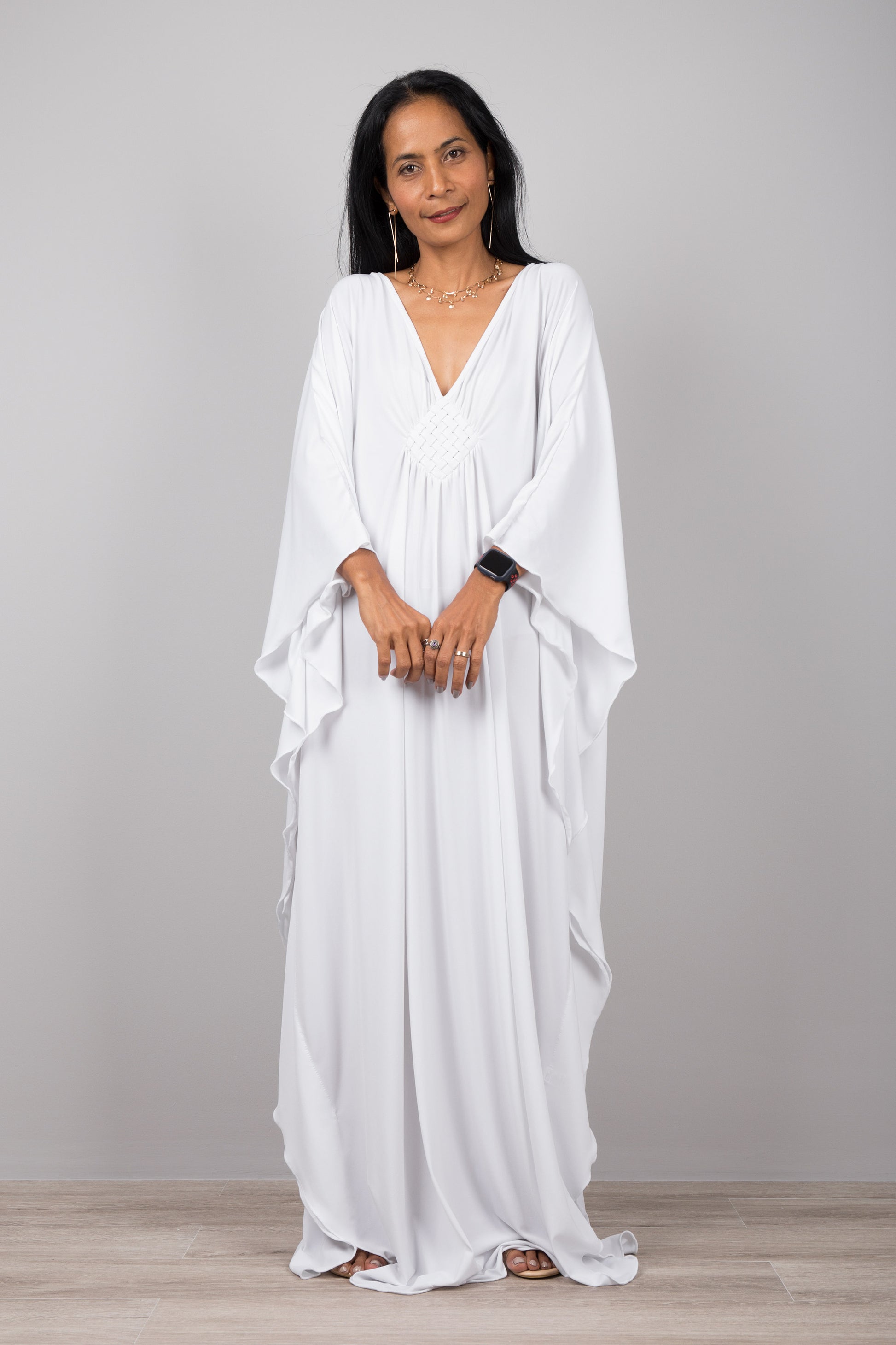 White kaftan dress with plunging neckline.  Buy your timeless kaftans online from Nuichan.  Express worldwide delivery via DHL.