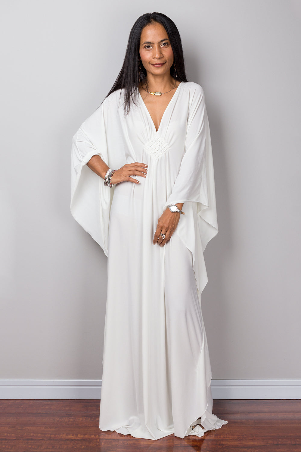 Shop White caftan for women online.  Buy long white maxi dress by Nuichan.  White frock dress with plunging neckline.