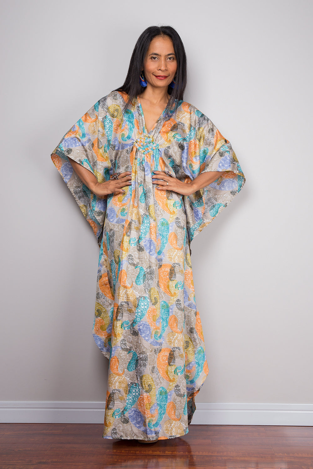Woman wearing petite caftan dress with paisley print