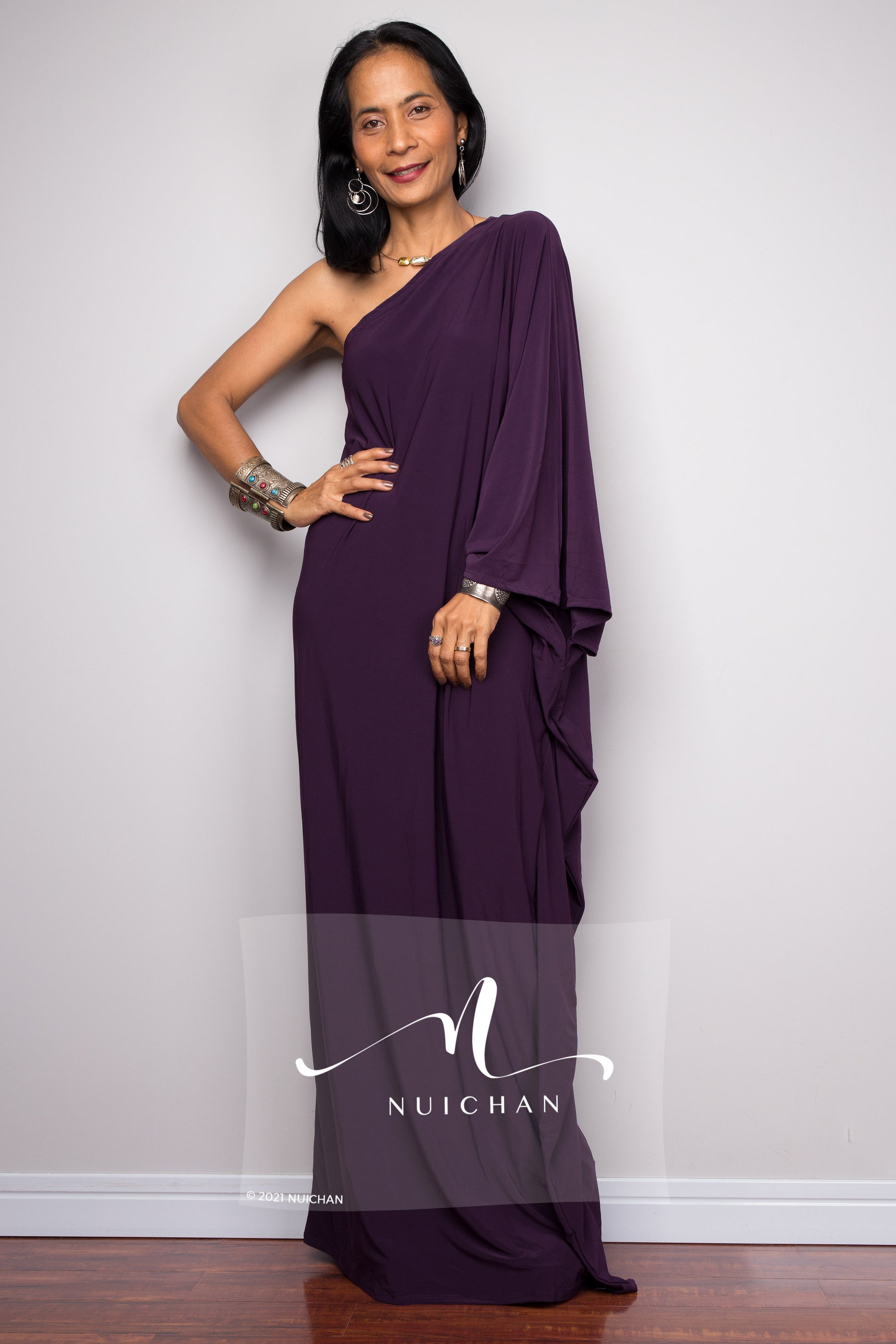 Captivating one-shoulder purple dress with a fluid silhouette, ideal for special occasions