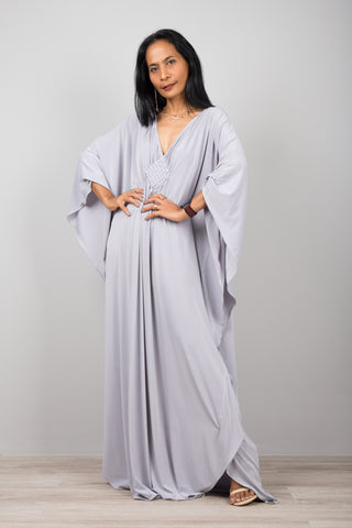 Light grey kaftan dress with plunging neckline.  Diamond shape woven detail just below neckline.  Halston style kaftan dress by Nuichan