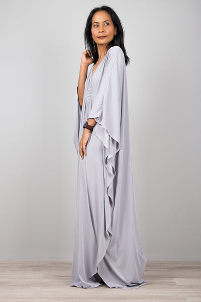 Light grey kaftan dress with plunging neckline.  Diamond shape woven detail just below neckline.  A true classic toga dress by Nuichan