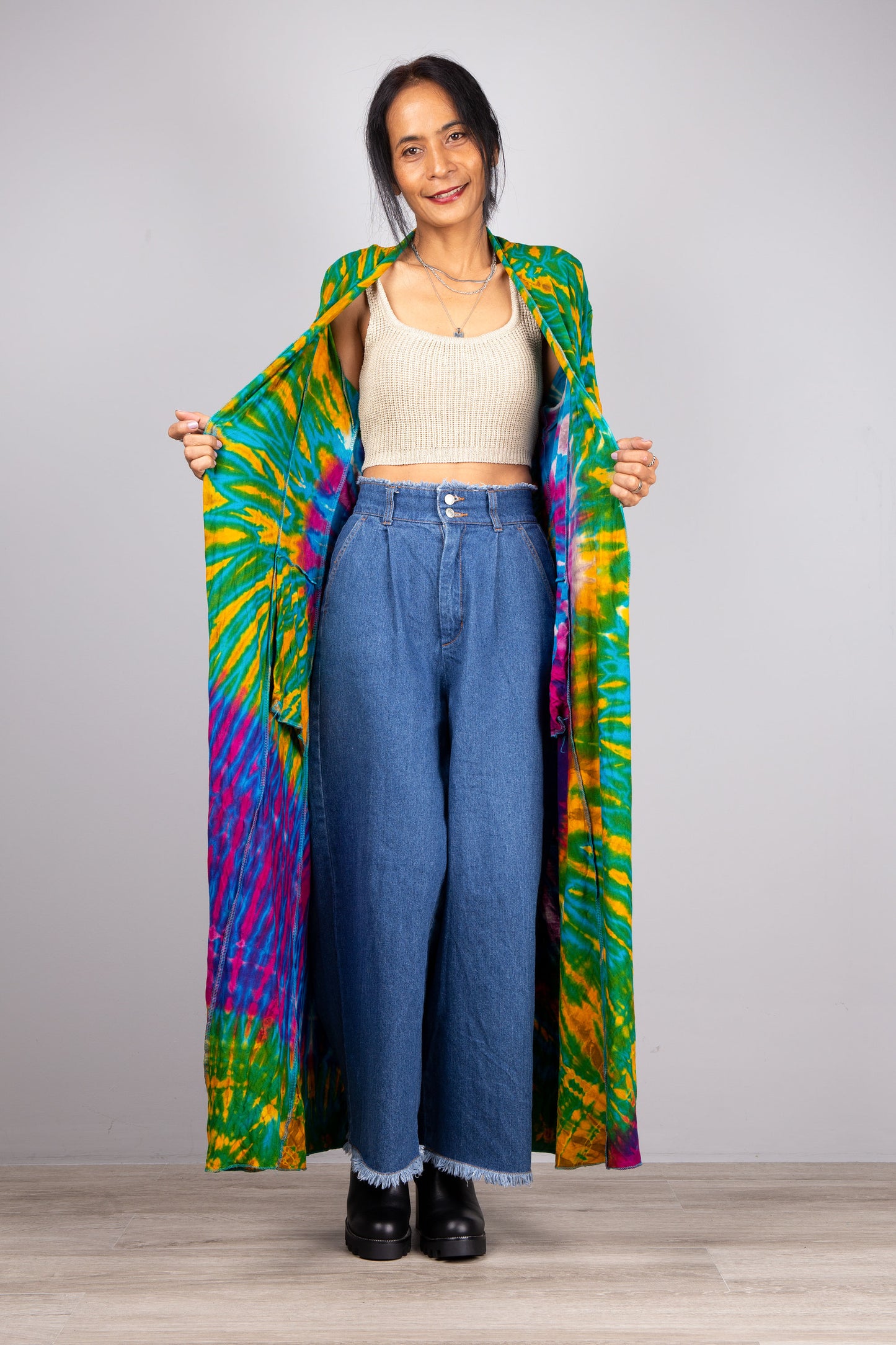 Green and purple tie dye cardigan.  Model shows inside which has yellow colour spiral.
