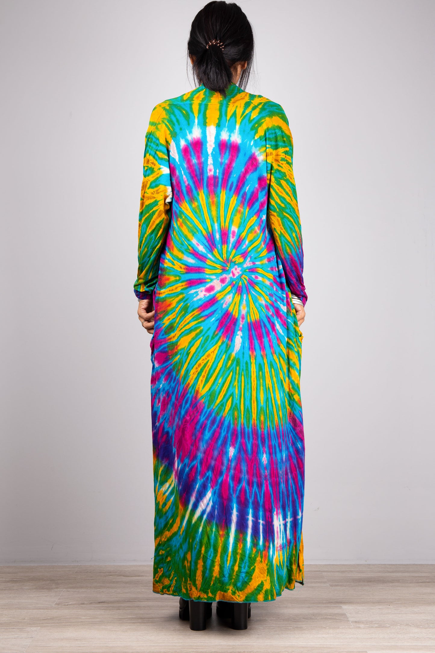 Tie dye cardigan.  Back view. Purple and green spiral