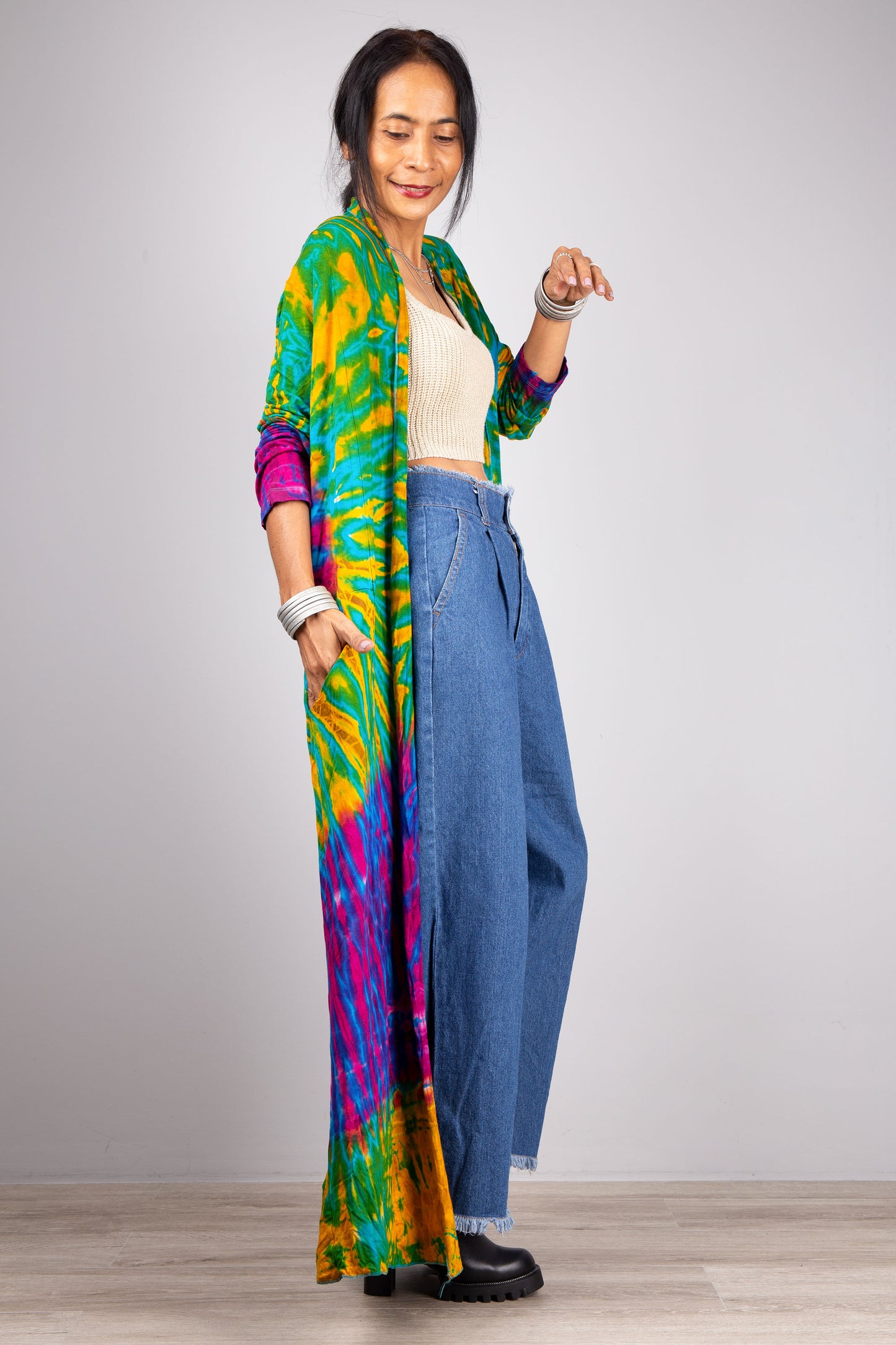 Side view, hand in pocket tie dye cardigan