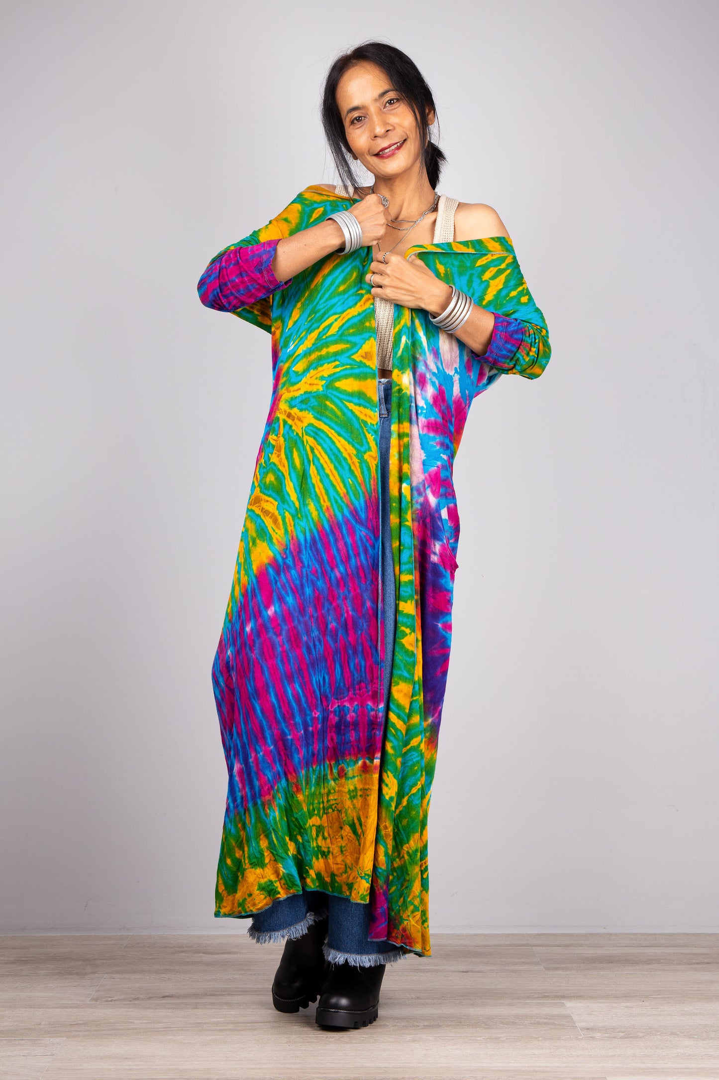 Model wrapped in tie dye cardigan